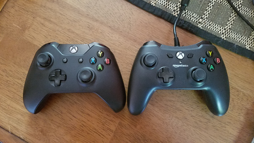 Photo of an Xbox One controller on the left and AmazonBasics controller on the right.